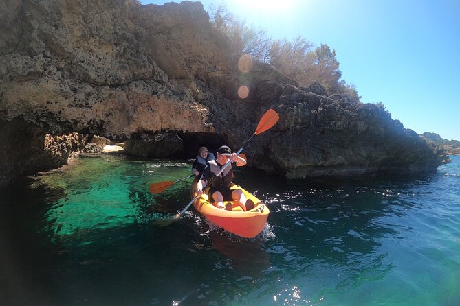 Alcudia: Guided Sea Kayaking & snorkelling Tour (day & sunset) - Swimming into the cave and the light the guides bring
