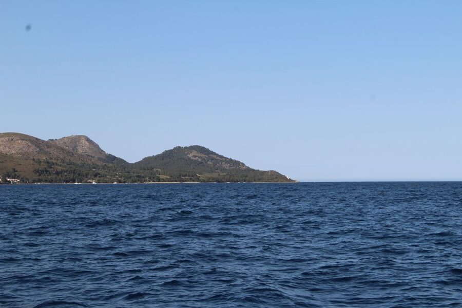 Alcudia: Private Sunset Boat Trip with Glass of Wine & Snack - Entering Alcúdia Bay by Llaüt: The Pace You’ll Feel Immediately