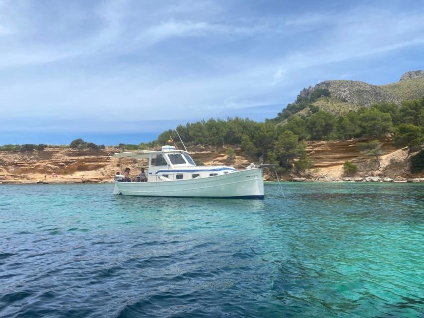 Alcudia: Private Sunset Boat Trip with Glass of Wine & Snack - Meet Your Captain and Get Ready for Real Boat Time