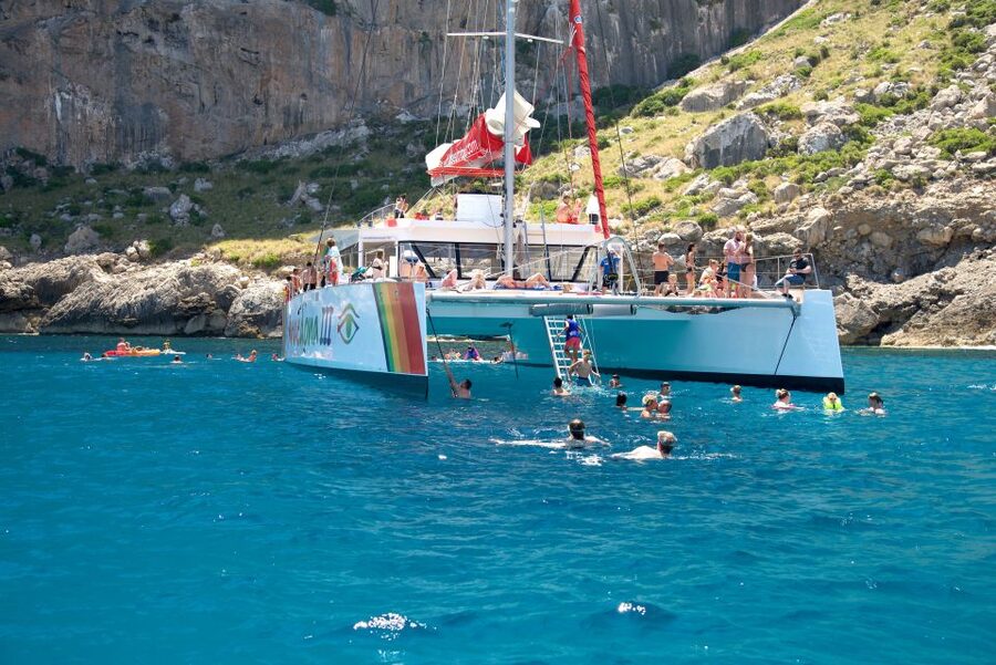 Alcudia: Sunset Catamaran Tour with Dinner and Snorkeling - On-board atmosphere: music, a bar, and why it feels easy