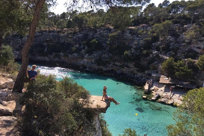 Beach Tours Mallorca. The Happy Vans. - Snorkeling over stones tied to cathedral construction, plus water over rocks