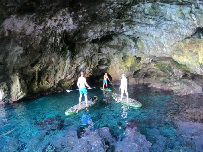 Cala Ratjada: SUP SAFARI TOUR 2H - Entering Cala Ratjada Water, meet your guides at the shop
