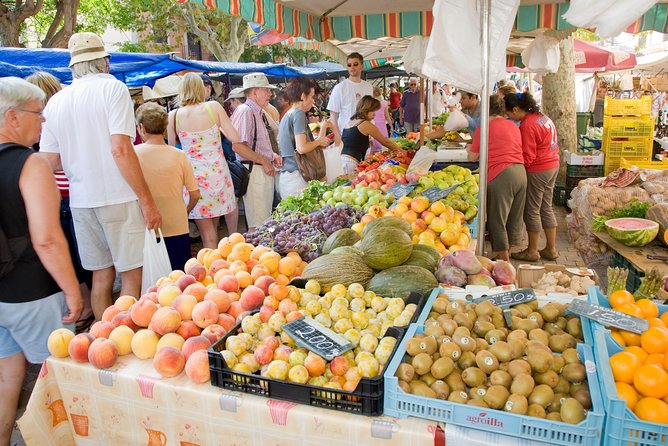 Discover Alcudia old town on a private walking tour - Carrer Major for stores, tapas, and a natural post-tour hangout
