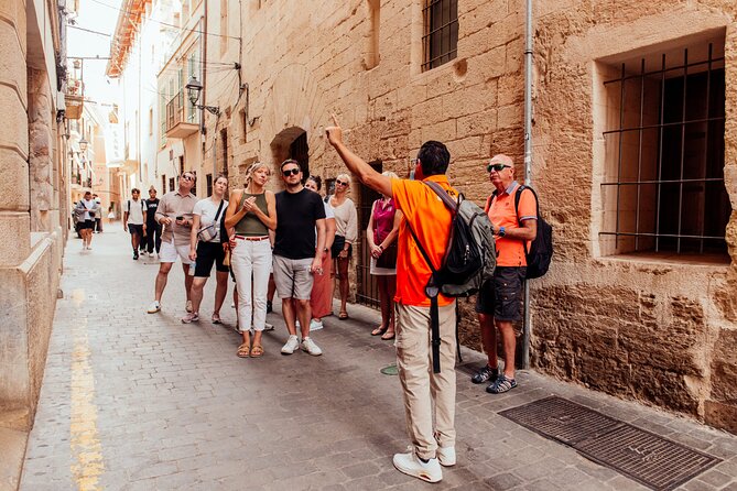 Food Tasting Walking Tour in Palma with a Local - Plaça de Sant Francesc: Warm Ensaimada, Almond Ice Cream, and a Liqueur Toast