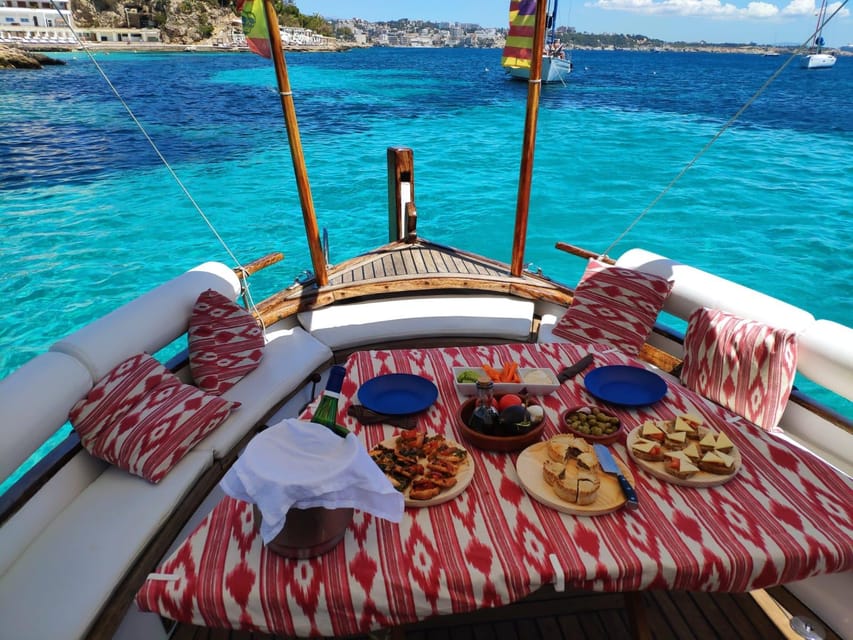 Mallorca: Llaüt Excursion around Palma with food and drinks - Punta Negra Stop: Sand and Pebbles, a Wooden Jetty, and Quiet Swimming