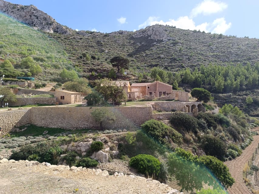 Mallorca: Sant Elm to La Trapa Monastery Guided Hike - The walk uphill: rocky footing, changing scenery, and photo breaks