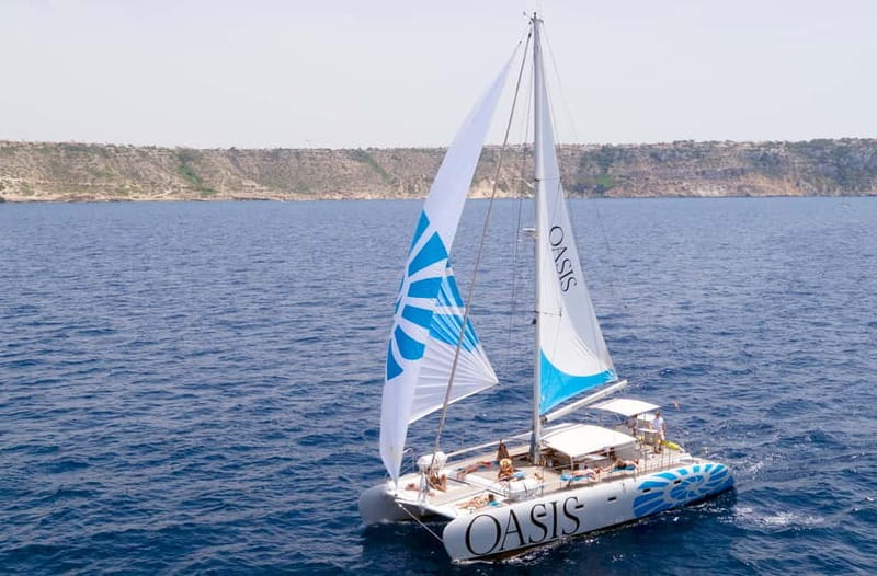 Palma de Mallorca: Deluxe Catamaran Sailing Tour with Meal - Cala Vella swim stop: clear coves, snorkeling setup, and SUP time