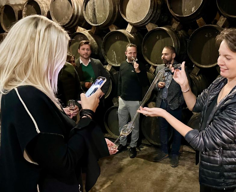Palma: Distillery Tour with 3 Spirits and Tapas Tasting - Entering the Bodegas Suau underground cellar